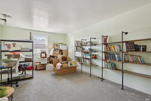 living area featuring carpet