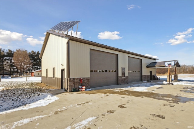 view of snow covered garage