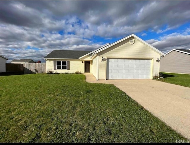 ranch-style home with a garage and a front lawn