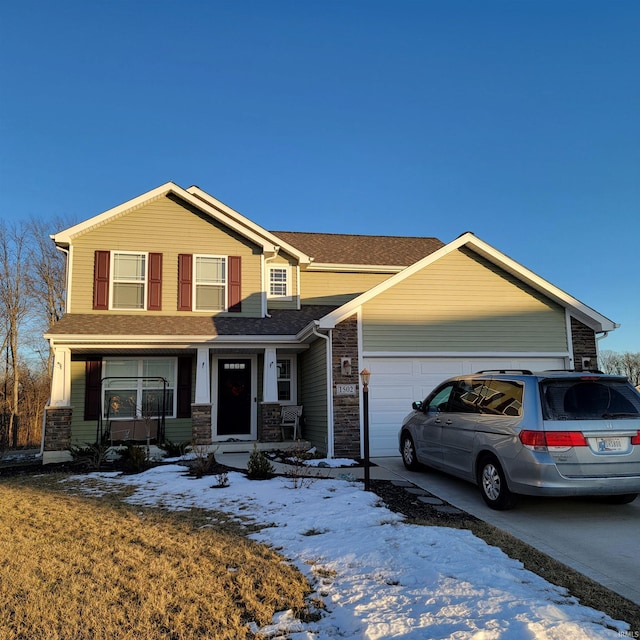 view of front of home with a garage and a porch