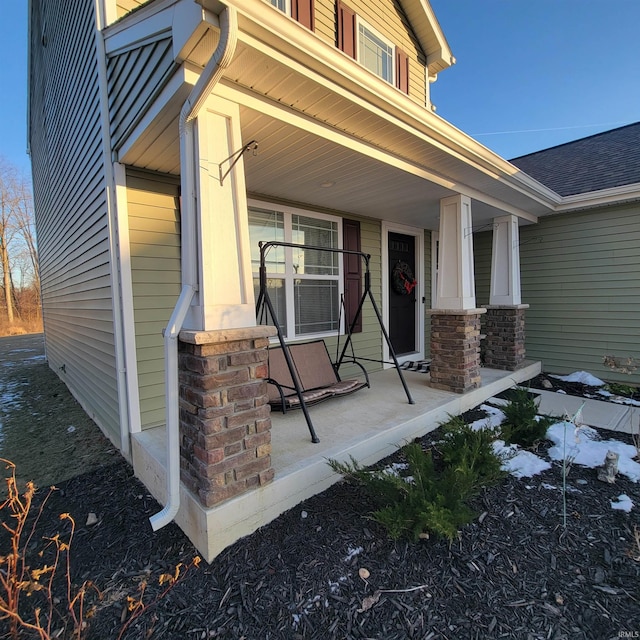 doorway to property featuring covered porch