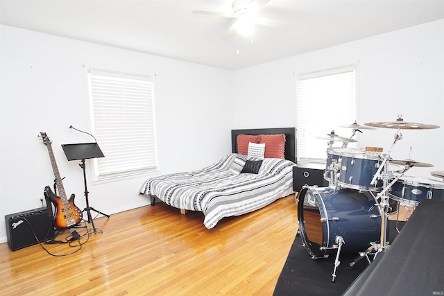 bedroom featuring hardwood / wood-style floors and ceiling fan