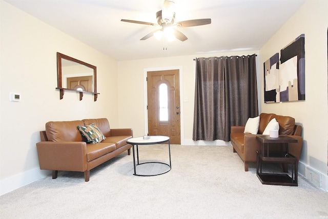 carpeted living room featuring ceiling fan