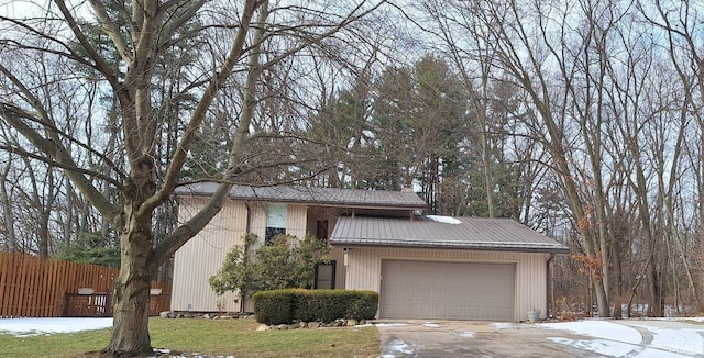 view of front of house with a garage and a front lawn