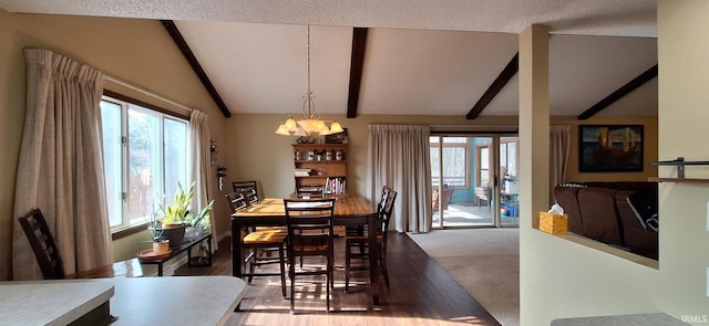 dining space with an inviting chandelier, a wealth of natural light, carpet floors, and vaulted ceiling with beams