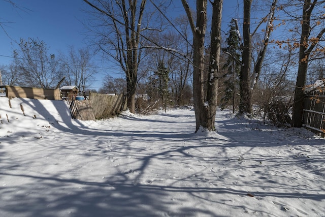 view of yard layered in snow