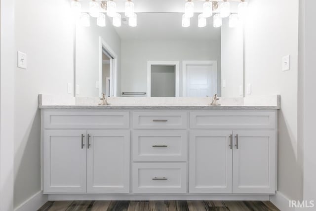 bathroom featuring hardwood / wood-style flooring and vanity