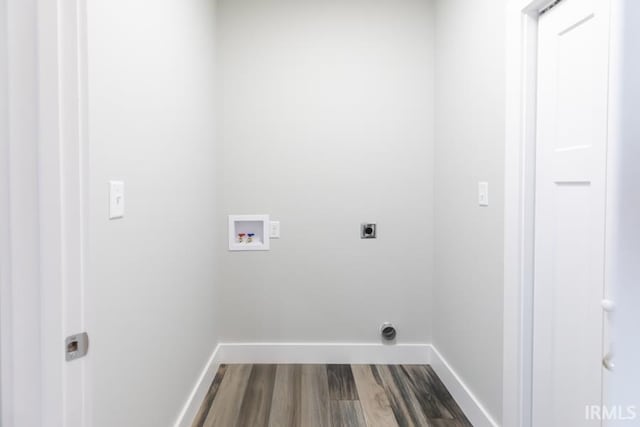 clothes washing area featuring washer hookup, hardwood / wood-style floors, and electric dryer hookup