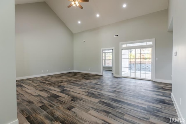 empty room featuring ceiling fan, dark hardwood / wood-style flooring, and high vaulted ceiling