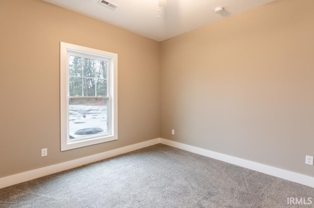 unfurnished room with carpet flooring