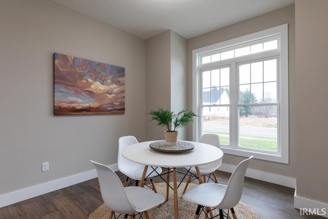 dining space featuring dark hardwood / wood-style floors