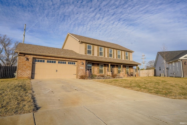 view of front of property with a garage, a front yard, and a porch