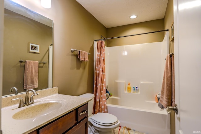 full bathroom featuring vanity, shower / bath combination with curtain, and toilet