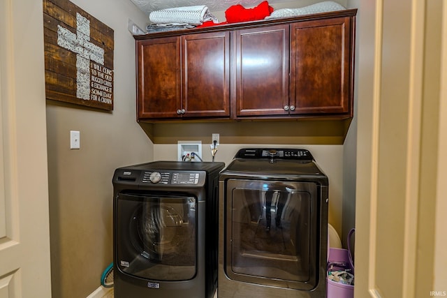 laundry area featuring cabinets and independent washer and dryer