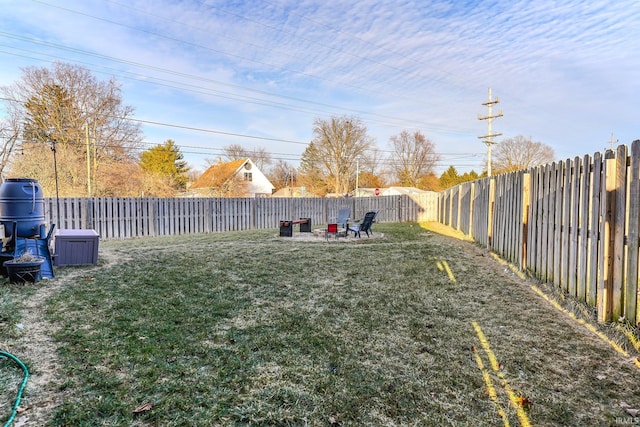 view of yard with a fire pit