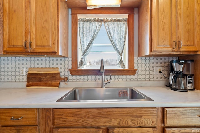 kitchen with tasteful backsplash and sink