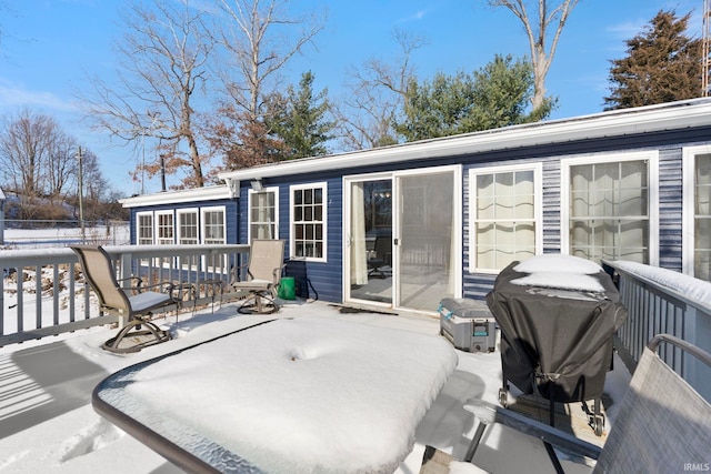 view of snow covered deck