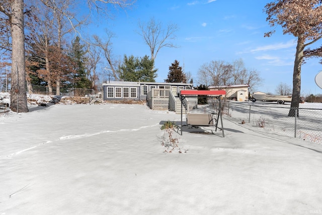 view of front of property featuring a wooden deck