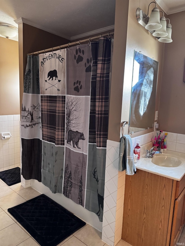 bathroom with crown molding, tile walls, vanity, tile patterned floors, and walk in shower