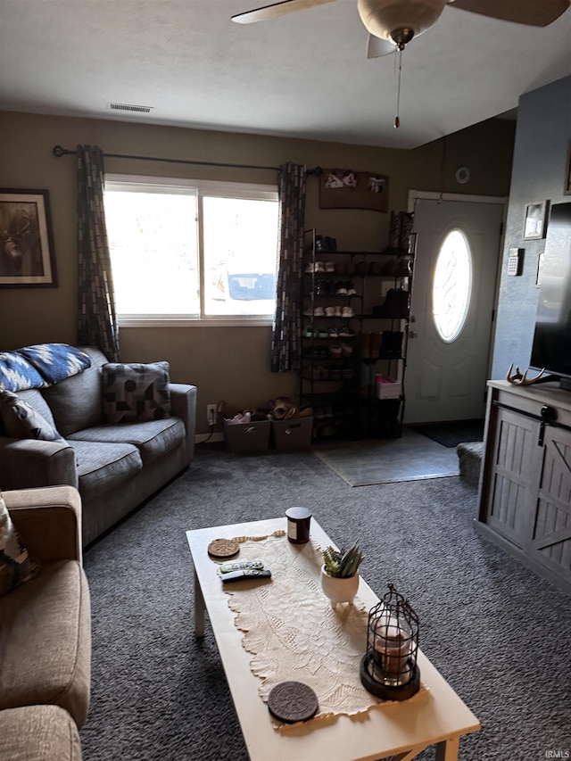 carpeted living room featuring lofted ceiling and ceiling fan