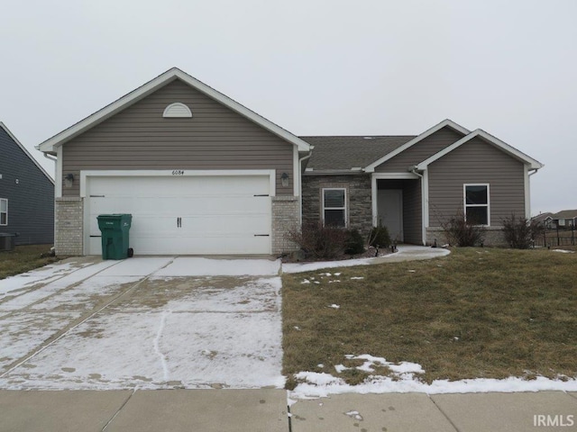 ranch-style home with a garage and a front yard