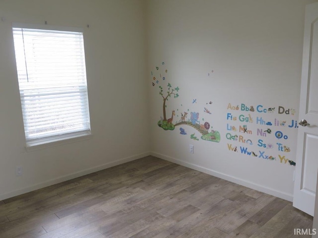 spare room featuring light hardwood / wood-style flooring