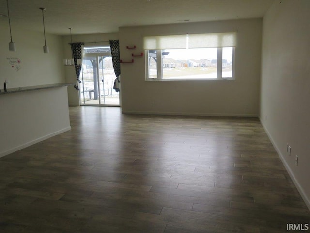 unfurnished room featuring dark wood-type flooring