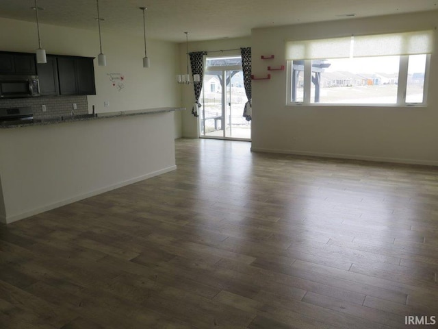 unfurnished living room featuring dark wood-type flooring