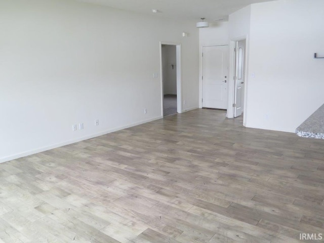 empty room with light hardwood / wood-style floors