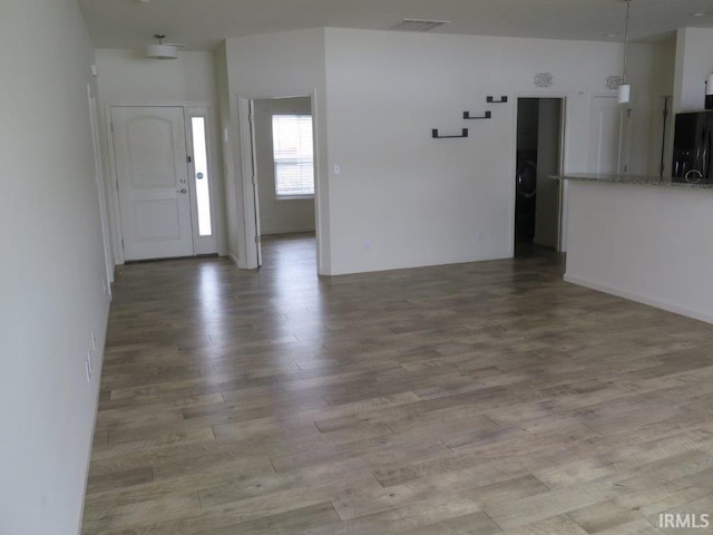 unfurnished living room featuring light hardwood / wood-style floors