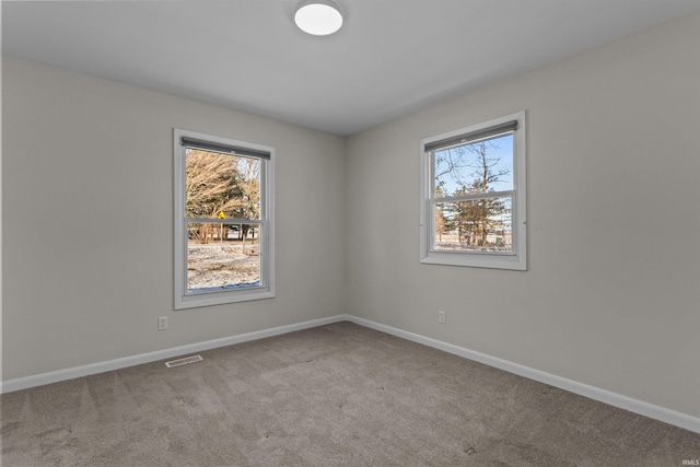 empty room featuring carpet flooring