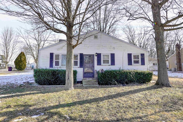 ranch-style home with a front lawn