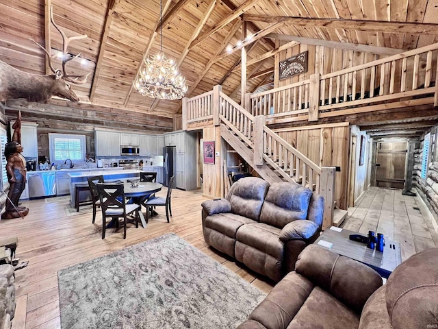 living room with beamed ceiling, wood ceiling, high vaulted ceiling, and light hardwood / wood-style floors