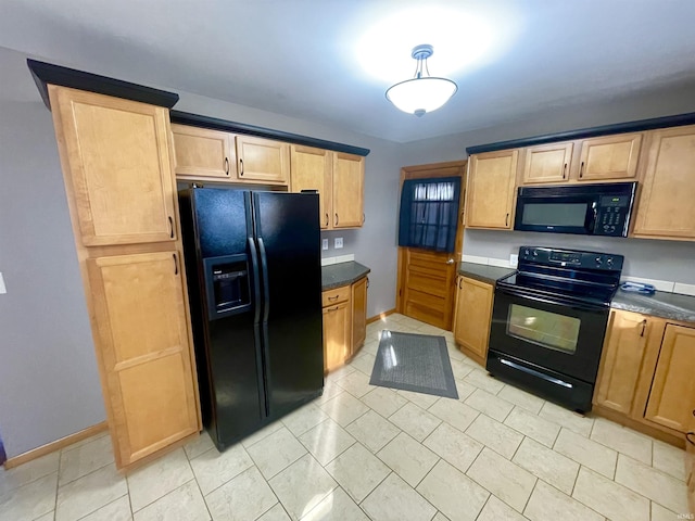 kitchen featuring light tile patterned floors and black appliances