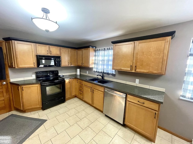 kitchen featuring sink and black appliances