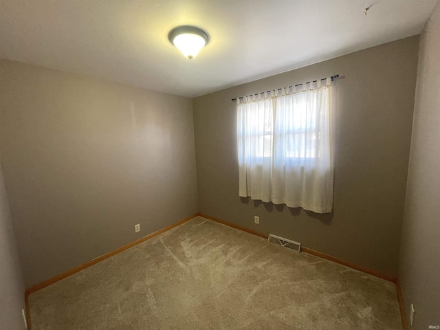 unfurnished room with carpet floors