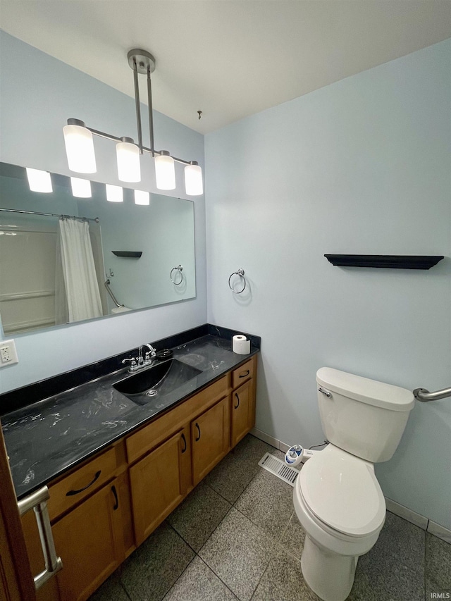 bathroom featuring vanity, toilet, and a shower with shower curtain