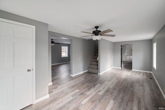 unfurnished room featuring hardwood / wood-style flooring and ceiling fan