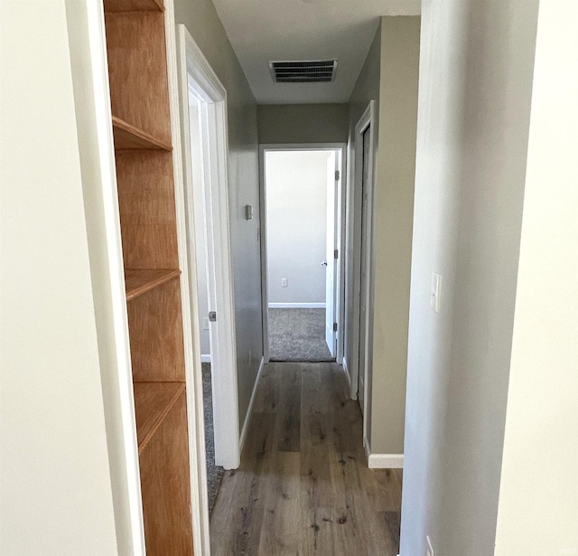 corridor featuring hardwood / wood-style flooring