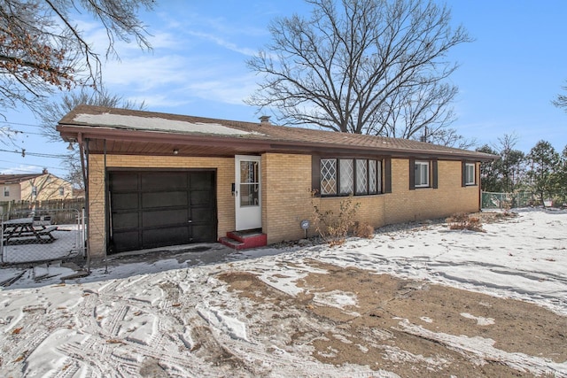 ranch-style home featuring a garage