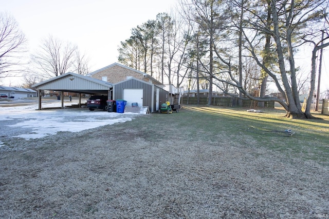 view of home's exterior featuring a carport, an outdoor structure, and a lawn