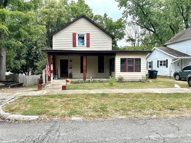 view of front of property with a front yard and a porch