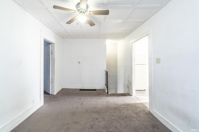 carpeted spare room featuring coffered ceiling and ceiling fan