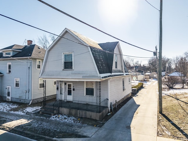 view of front of home with covered porch and central air condition unit