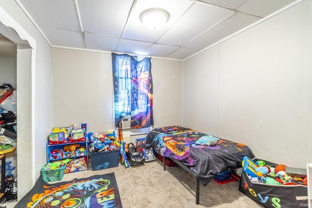 carpeted bedroom featuring a paneled ceiling