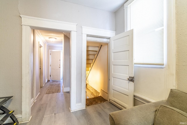 corridor with light wood-type flooring