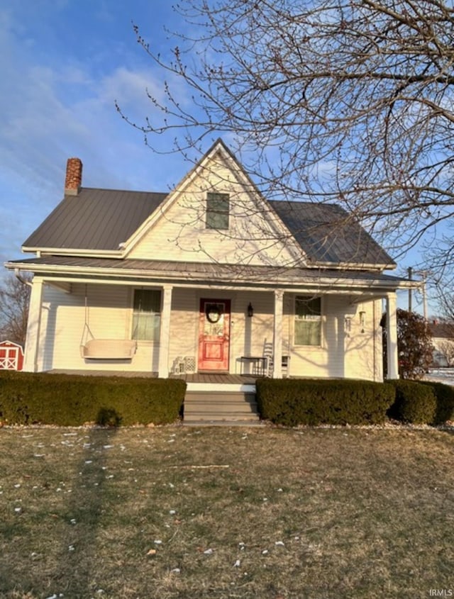 view of front facade with a porch and a front yard