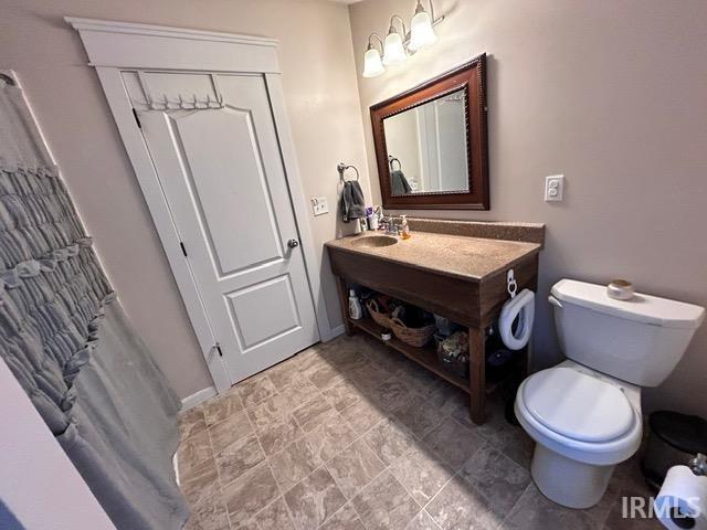 bathroom featuring sink and toilet