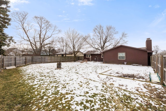 view of yard covered in snow