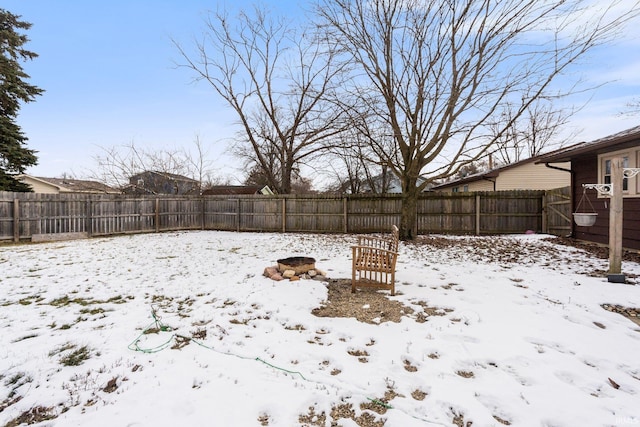 view of yard layered in snow